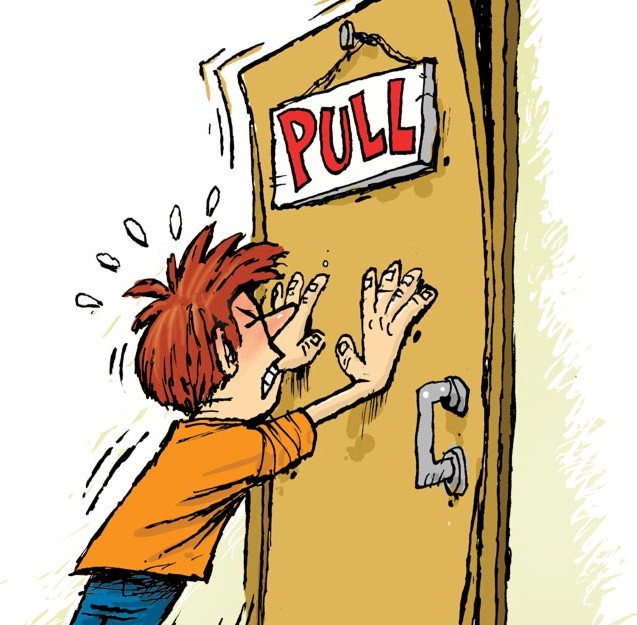 Cartoon of a student pushing hard on a door when it says to "pull"